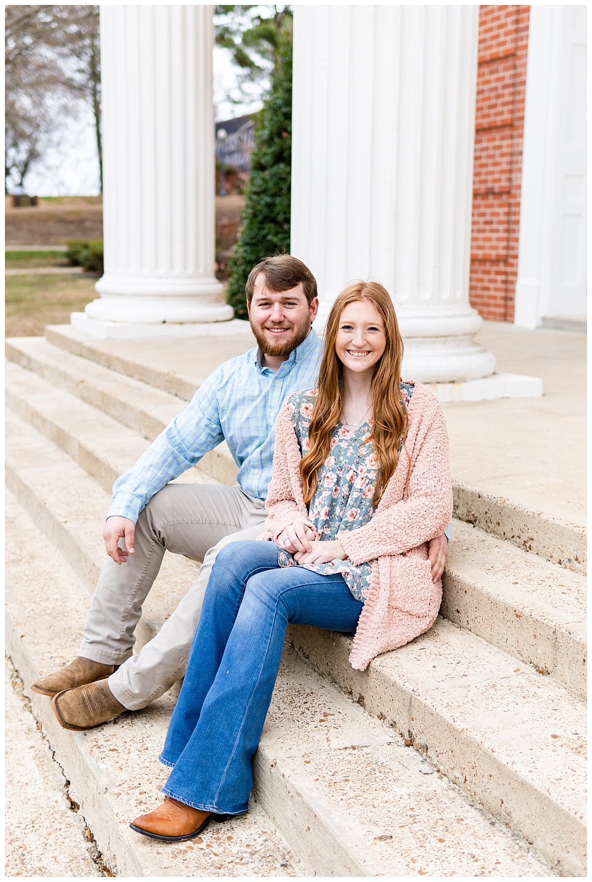 couple sits on steps of Brown's Chapel on Lyon College's campus in Batesville, Arkansas