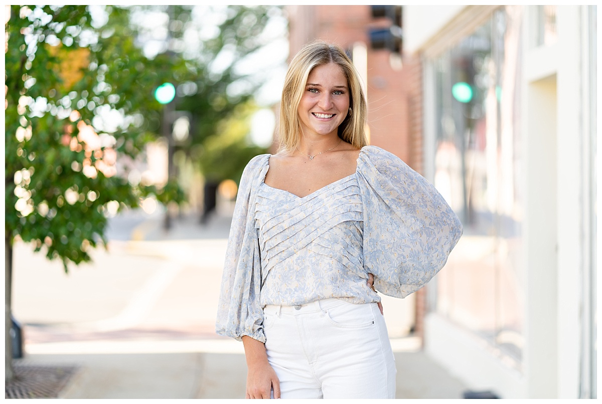 senior girl poses in downtown columbia missouri for her senior session with Hannah Carr Photography