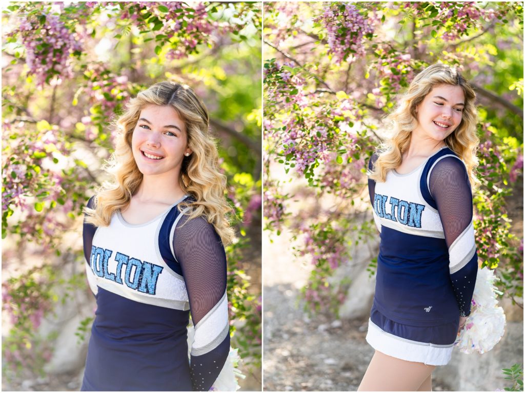 senior girl poses in dance uniform in front of a purple flowering tree for her senior portrait session in Columbia, Missouri with West Plains Missouri Wedding and Senior Portrait photographer, Hannah Carr Photography.