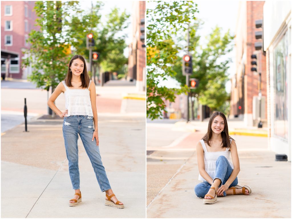 Senior girl poses on a sidewalk in downtown Columbia, MO for her senior portrait session with West Plains, MO photographer, Hannah Carr Photography