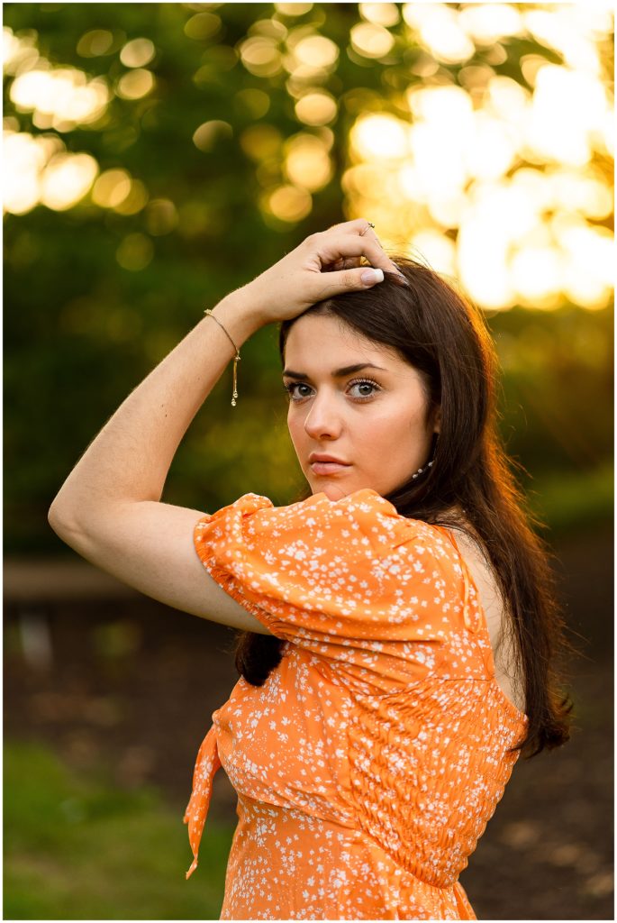 Senior girl poses at sunset at Shelter Gardens in Columbia Missouri for her senior session with West Plains Photographer, Hannah Carr Photography.