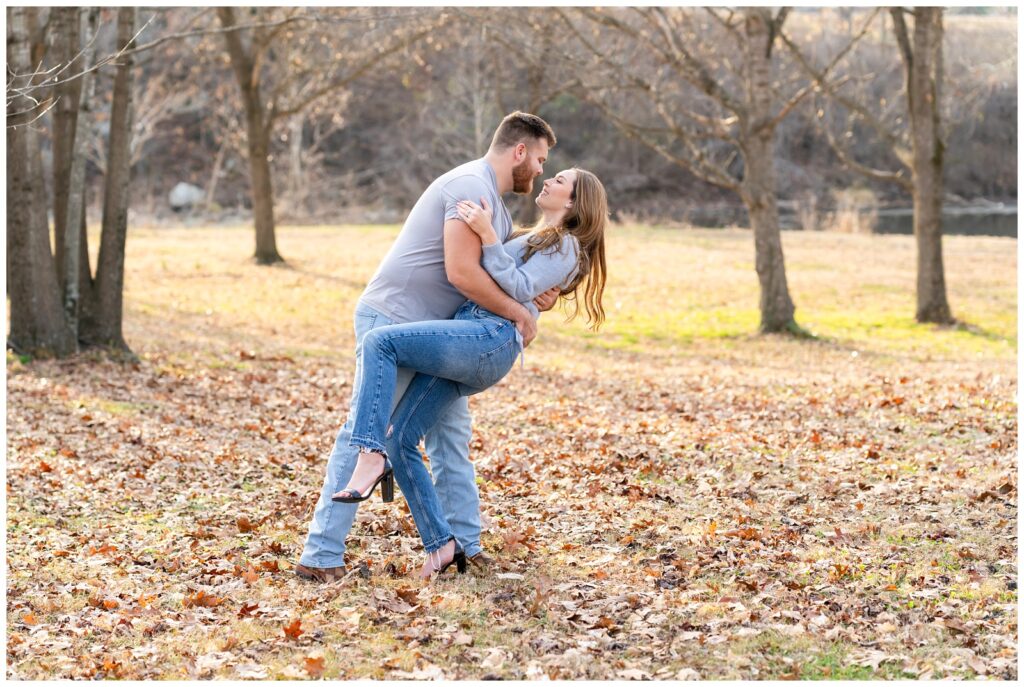 An engaged couple poses at Mammoth Spring State Park for their engagement session with Hannah Carr Photography.