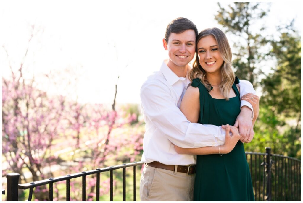 An engaged couple poses on a bridge at Big Cedar Lodge for their spring engagement session with Hannah Carr Photography, an Arkansas photographer located in Ash Flat, Arkansas