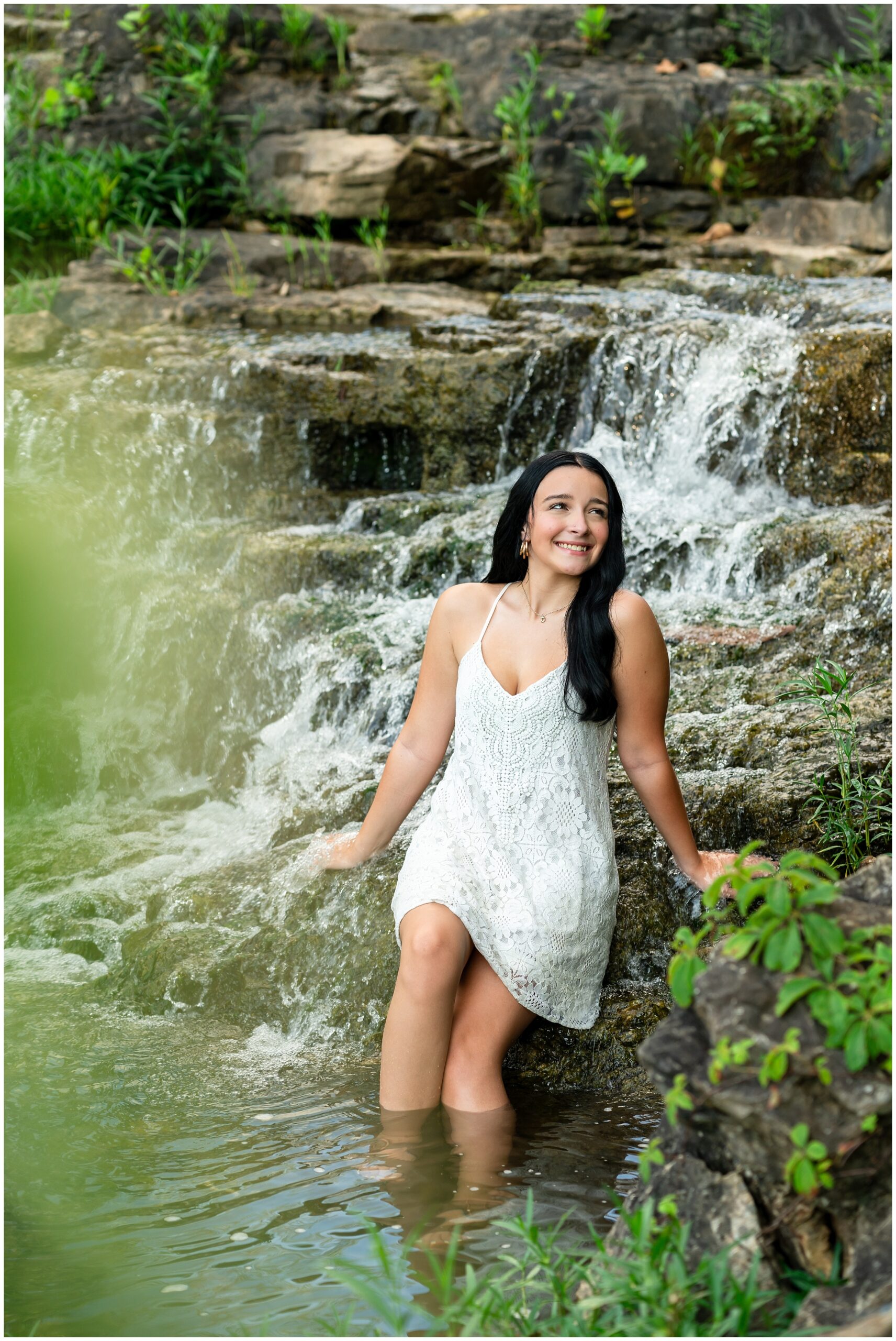 Highland High School senior, Dacy-Lynn, poses in a water fall in beautiful Cherokee Village, AR for her senior session with North Arkansas Senior Photographer, Hannah Carr Photography.