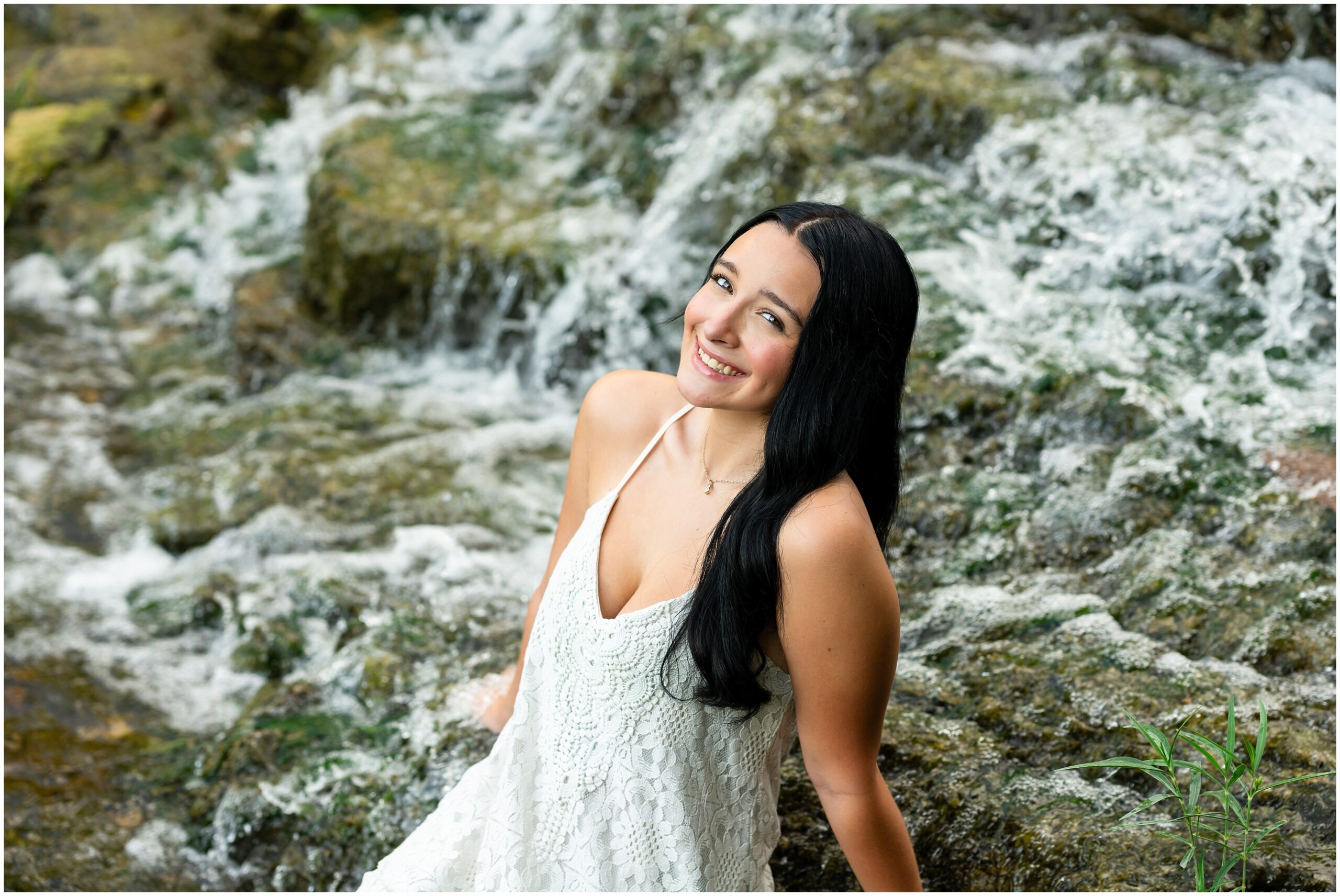 Highland High School senior, Dacy-Lynn, poses in a water fall in beautiful Cherokee Village, AR for her senior session with North Arkansas Senior Photographer, Hannah Carr Photography.