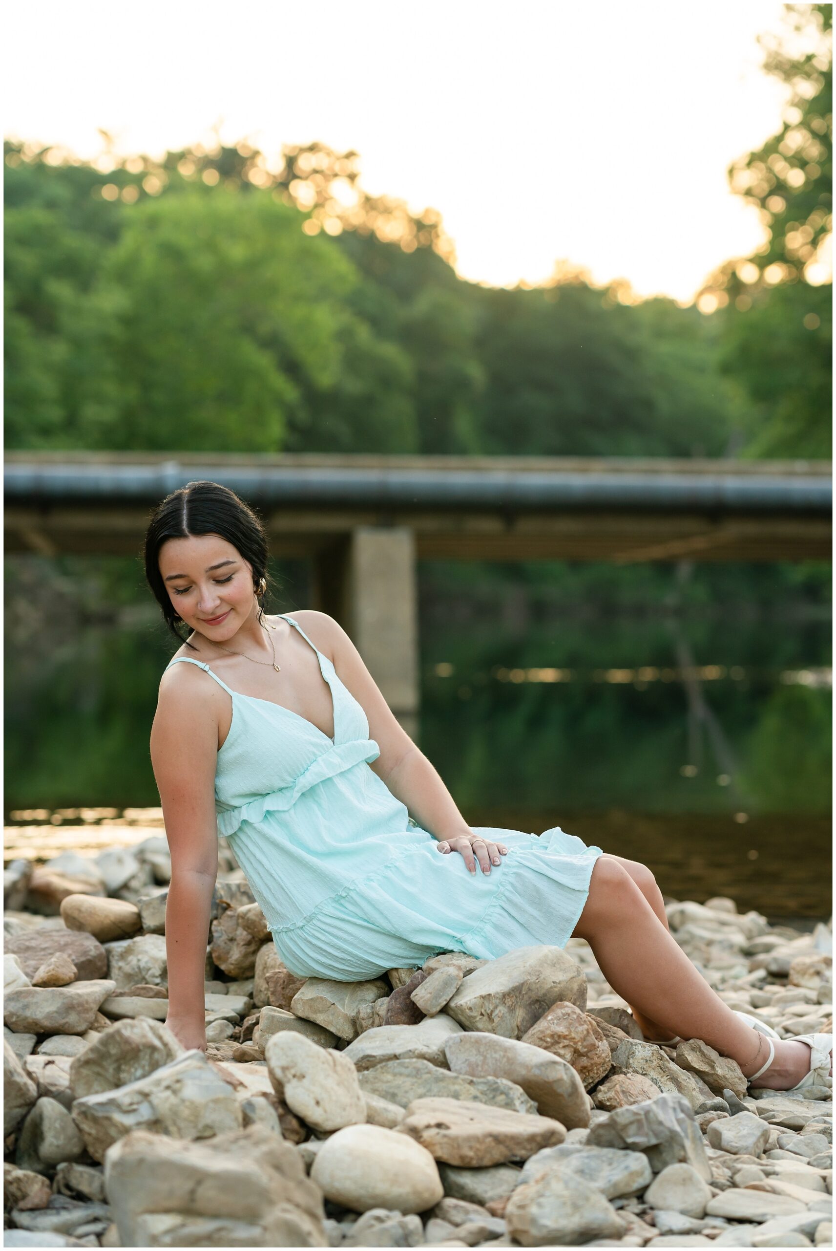 Highland High School senior, Dacy-Lynn, poses on a creek bank in beautiful Cherokee Village, AR for her senior session with North Arkansas Senior Photographer, Hannah Carr Photography.