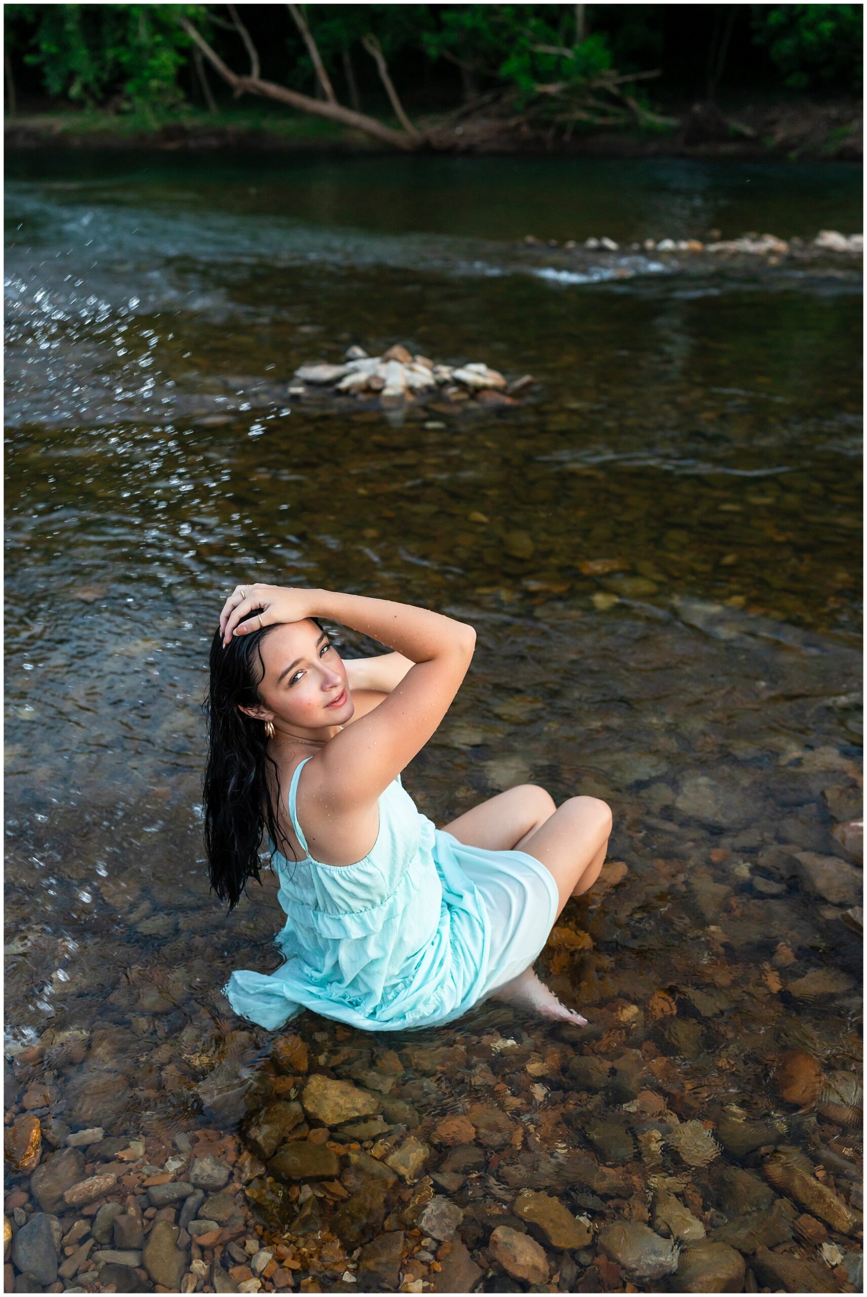 Highland High School senior, Dacy-Lynn, poses in a creek bed in beautiful Cherokee Village, AR for her senior session with North Arkansas Senior Photographer, Hannah Carr Photography.